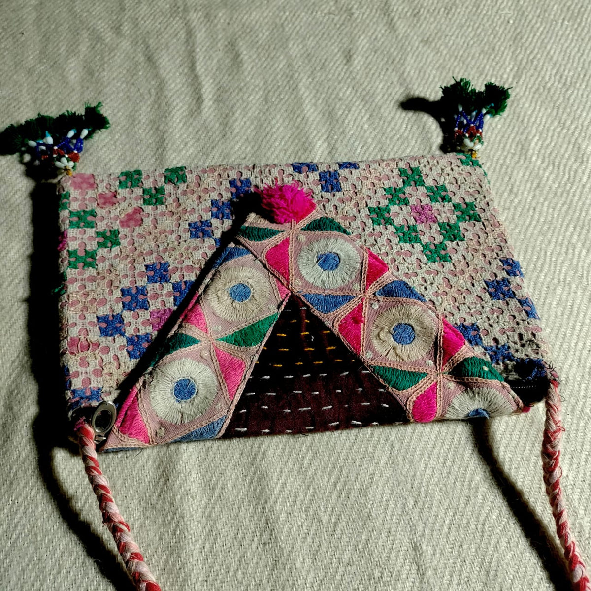 Embroidered sling bag