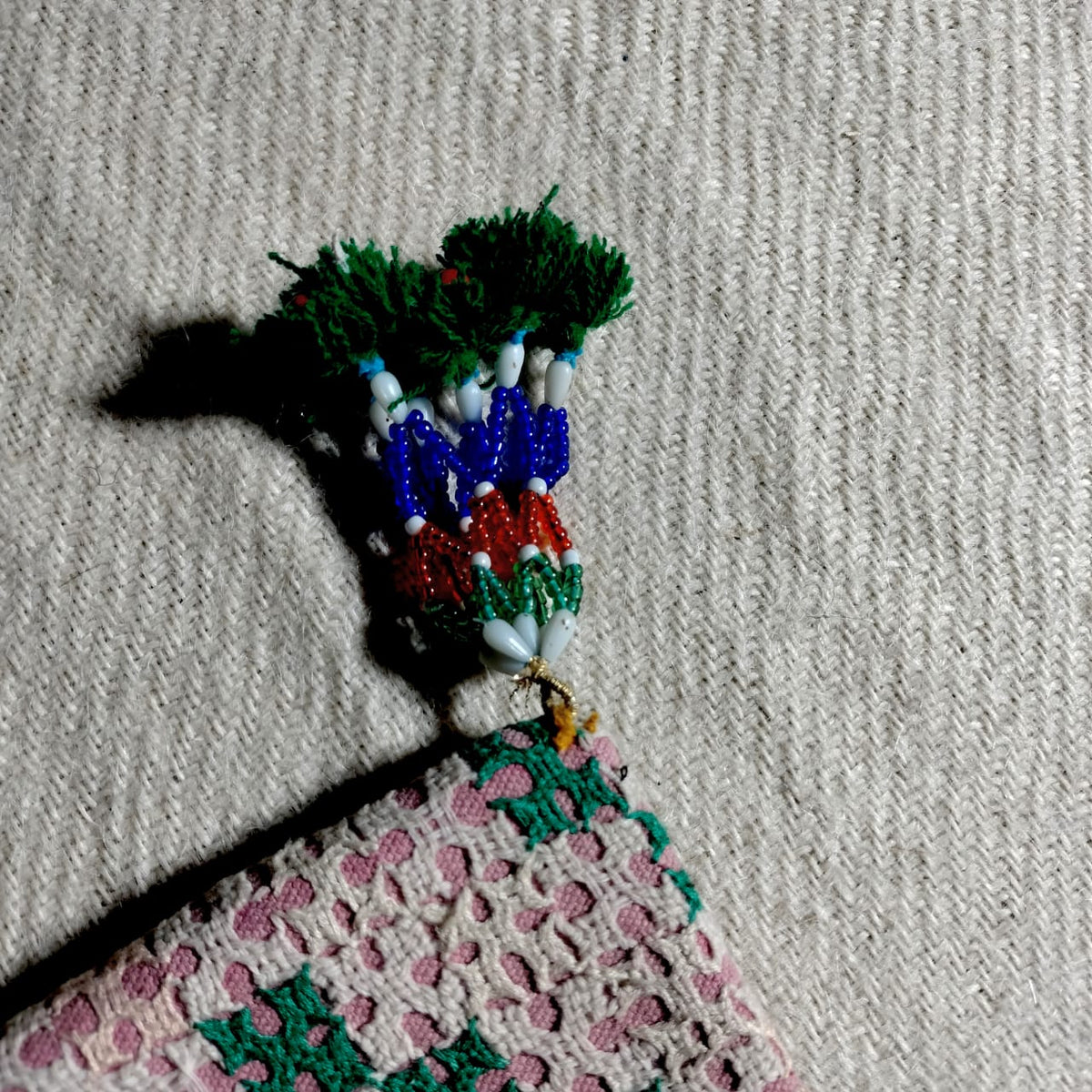 Embroidered sling bag