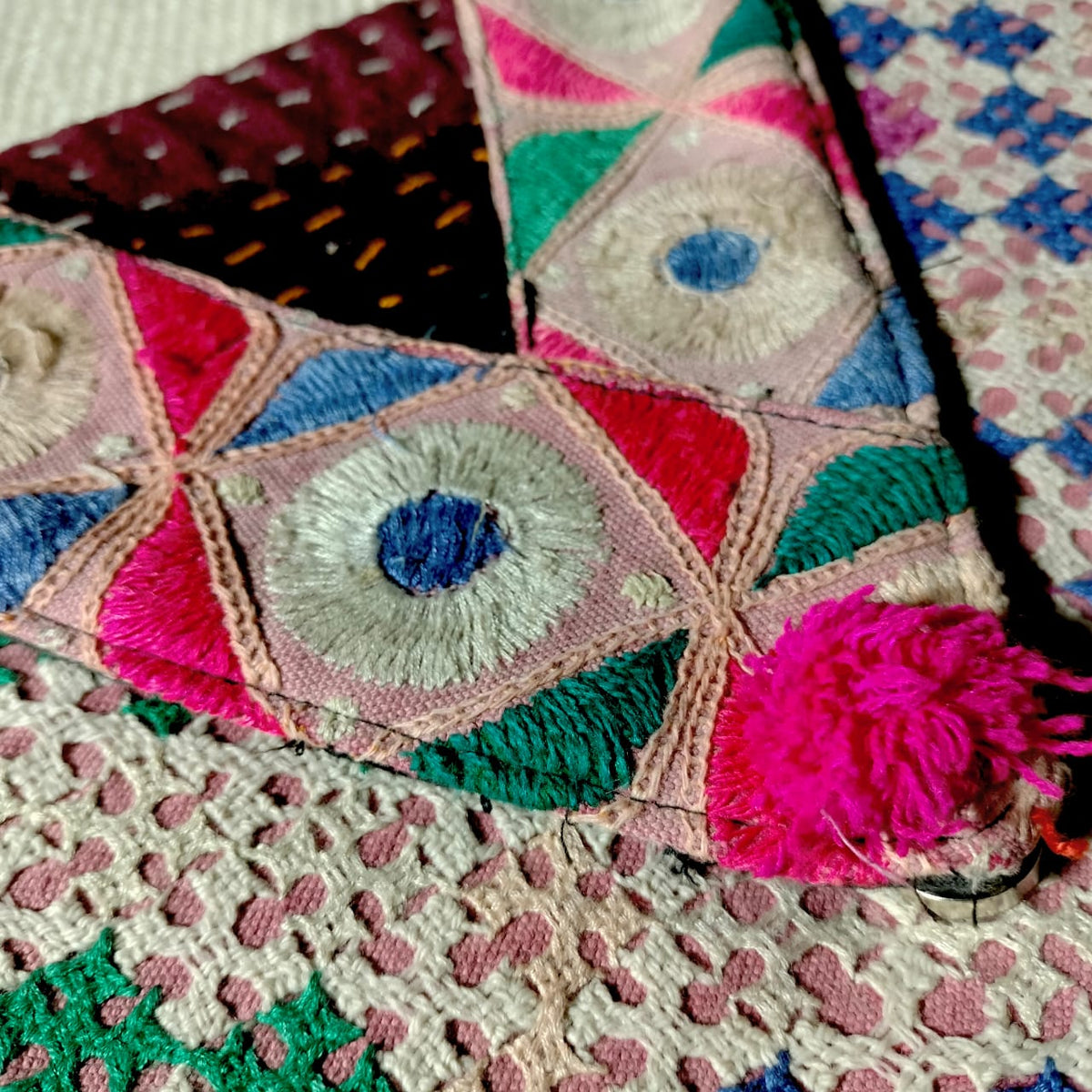 Embroidered sling bag