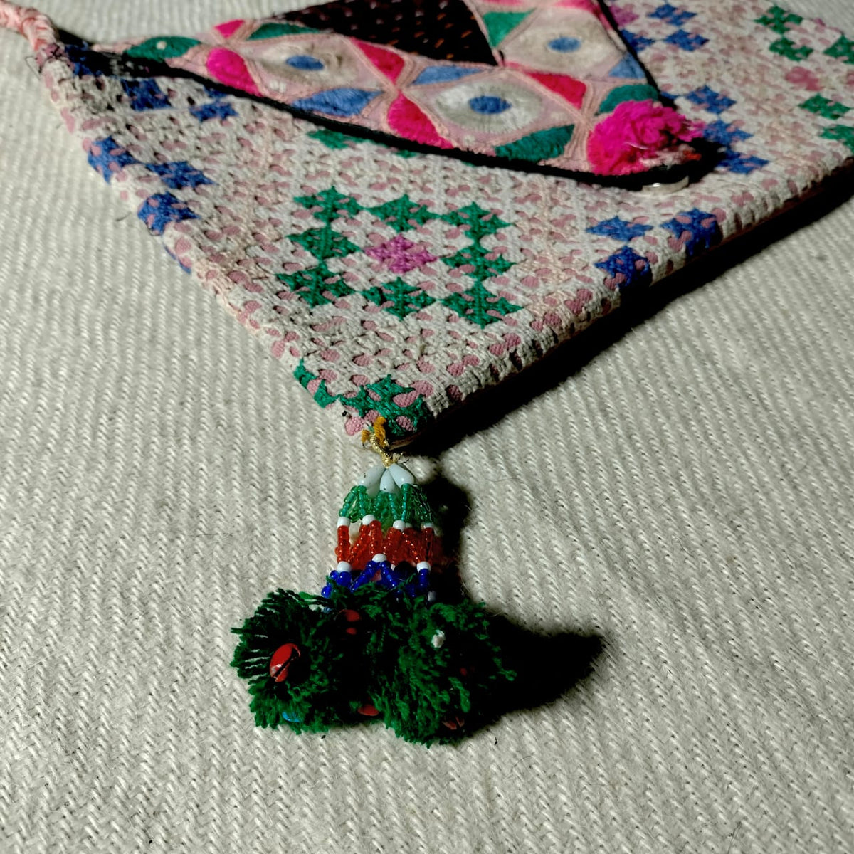 Embroidered sling bag
