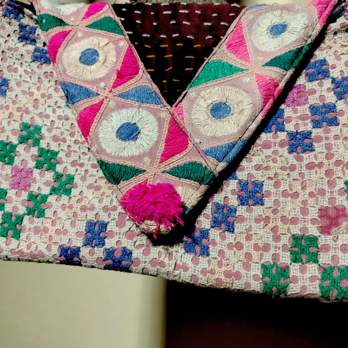 Embroidered sling bag