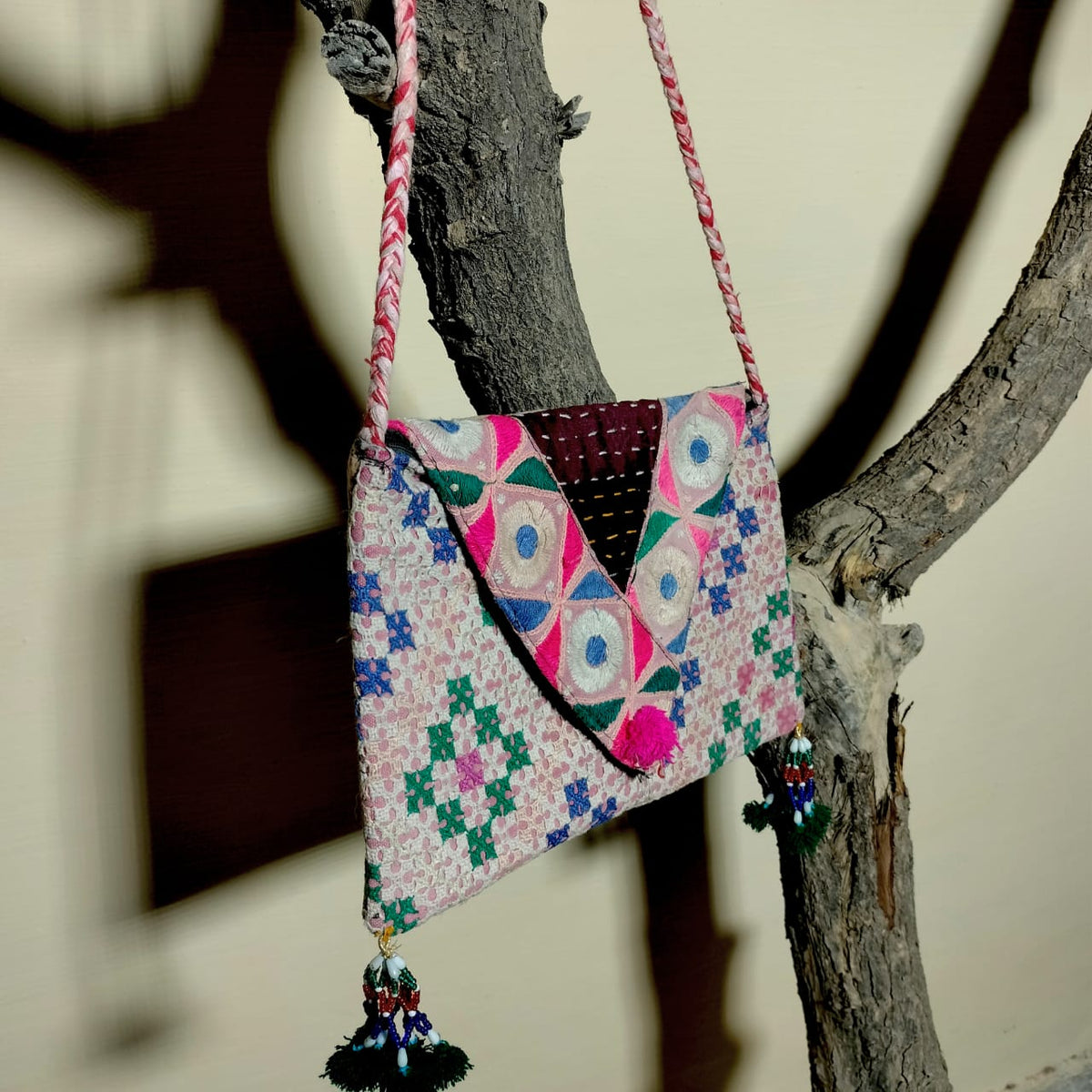 Embroidered sling bag