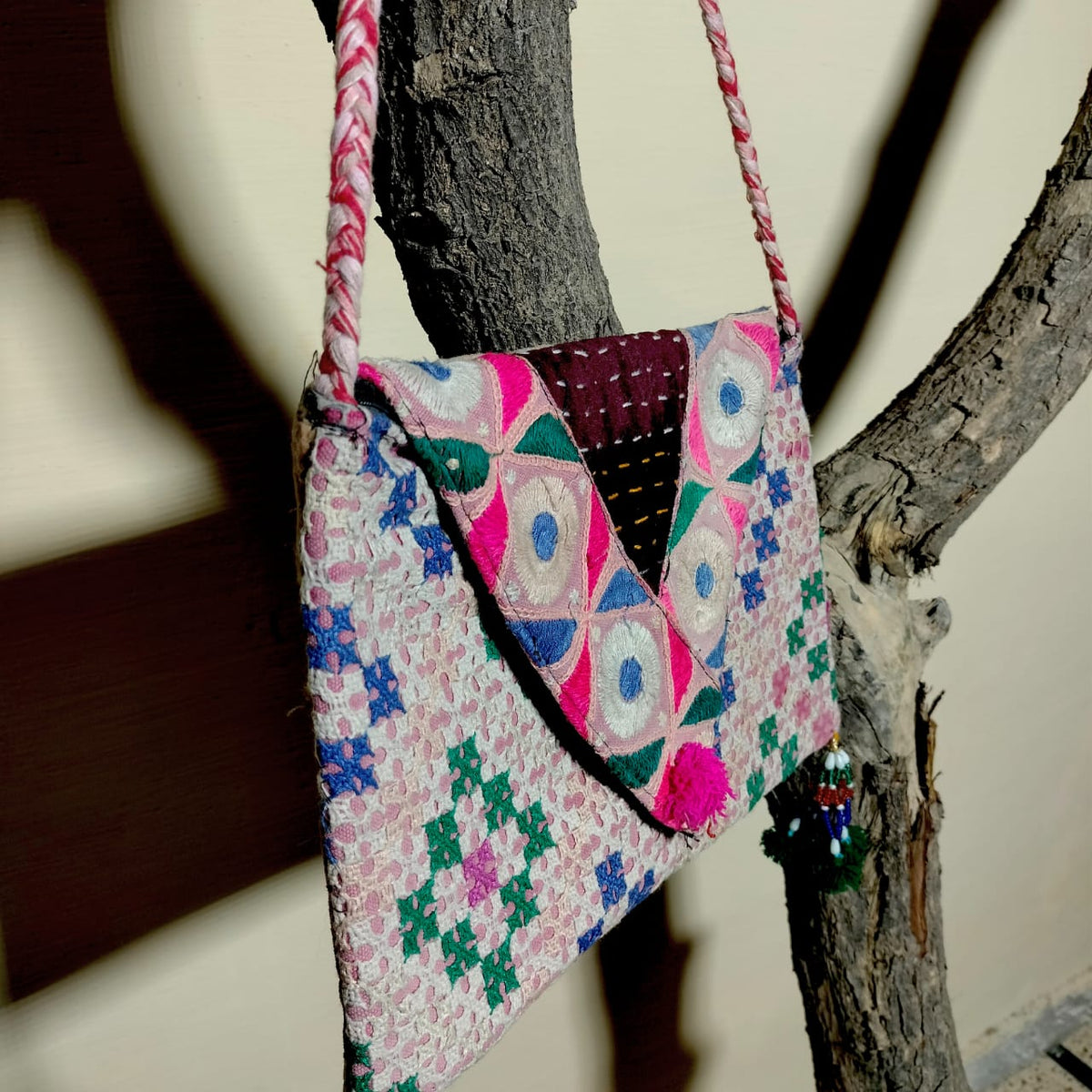 Embroidered sling bag
