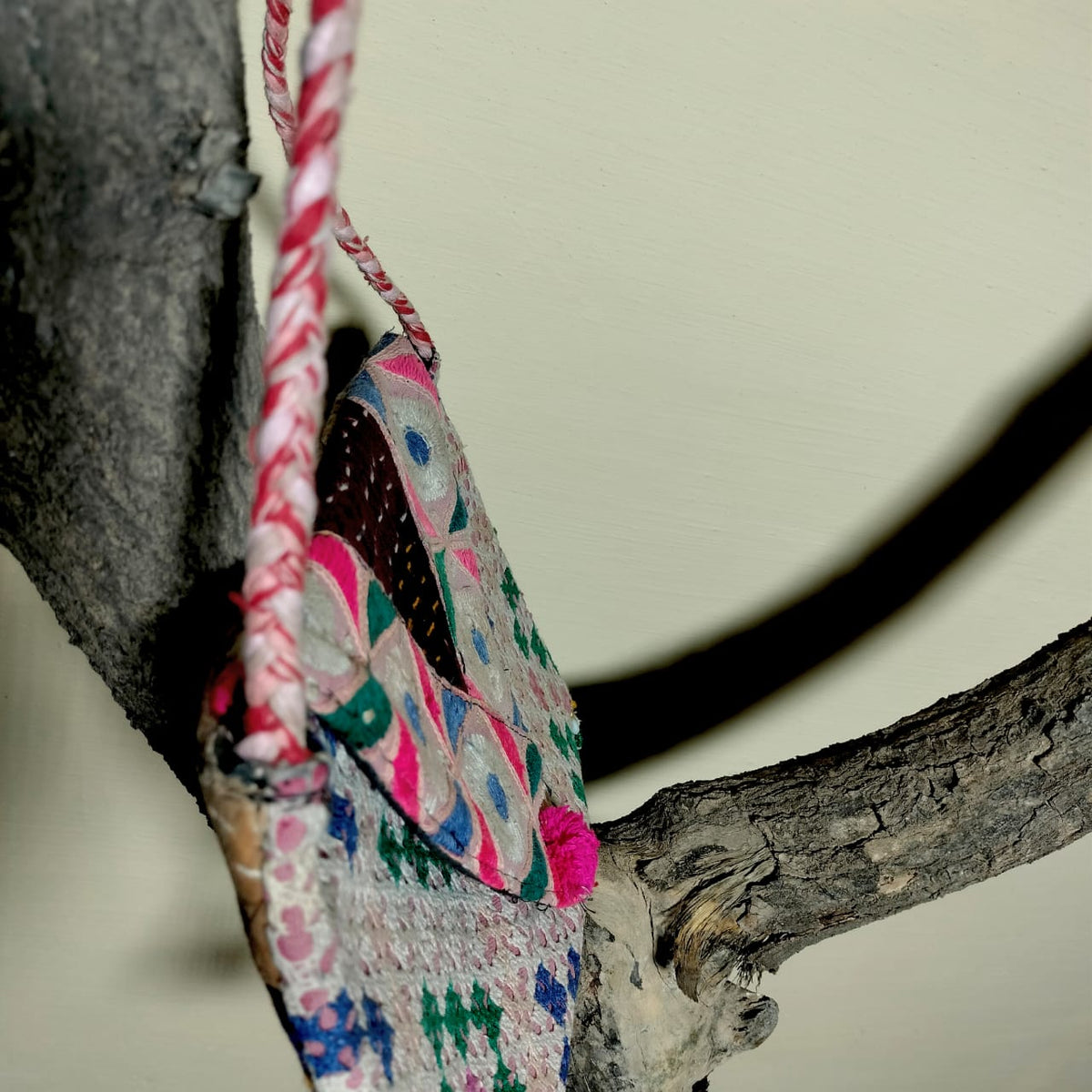 Embroidered sling bag