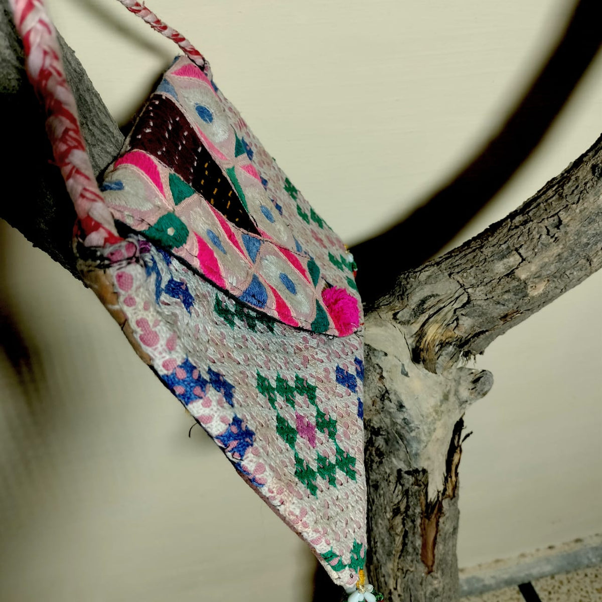 Embroidered sling bag